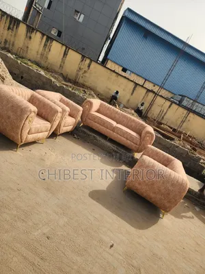Set of Cream Coloured Padded Sofa Chairs.