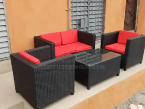 4 Piece Outdoor Rattan Sofas With Red Cushions Glass Coffee Table