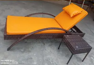 Luxury Rattan Outdoor Sun Lounger With Cushion and Side Table.