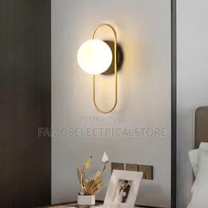 Gold Wall Sconce With Oval Loop Light