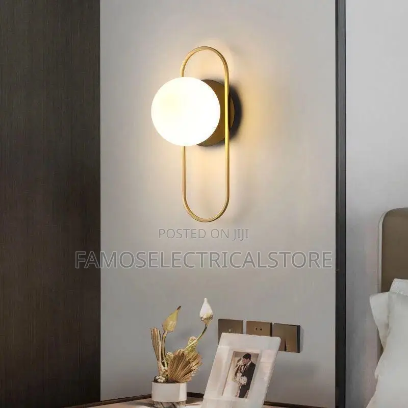 Gold Wall Sconce With Oval Loop Light