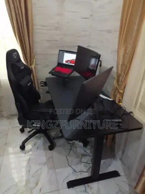An Electric Height Adjustable Desk 1.6meter With Game Chair
