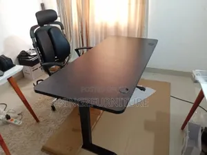 Electric Height-Adjustable Desk and an Ergonomic Executive Chair.