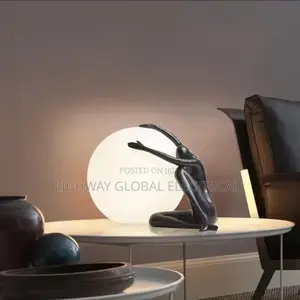 Italian Abstract Ball Holding Character Table Lamp