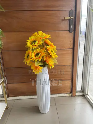 Sunflower in White Grooved Plastic Vase