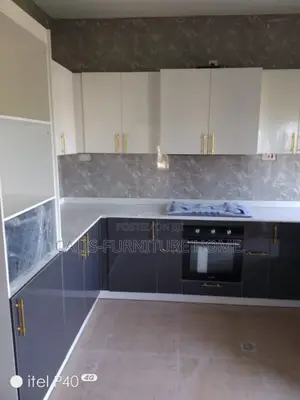 L-Shape Kitchen Cabinets. White and Grey Color