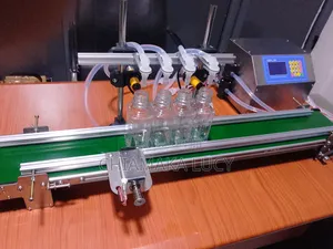 Four Nozzle Liquid Filler With Conveyor