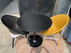 Modern Tulip Table 2 Perforated Chairs