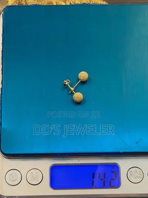 18 Karat Gold Stud Earrings.