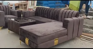 A Fabric L Shaped Set With a Center Table