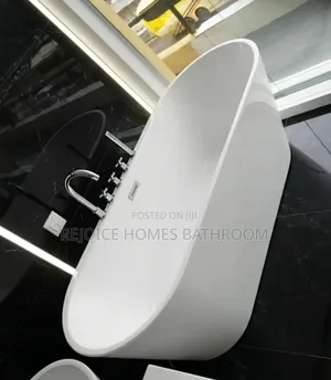 Luxury Freestanding White Bathtub With Chrome Fittings