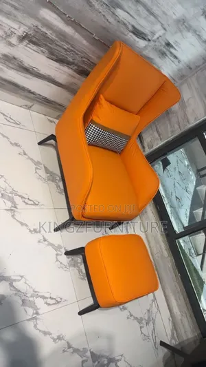 Orange Leather Wingback Lounge Chair