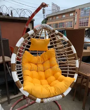 Hanging Egg Chair With Yellow Cushions