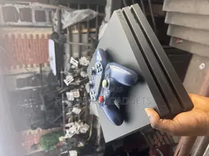 Playstation 4 Pro With 2 Wireless Controllers and Its Gadgets