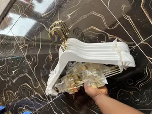 Gold and White Hanger With Clips