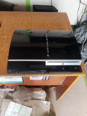 Sony Playstation 3 Console With Two Pads and 10 Games Inside