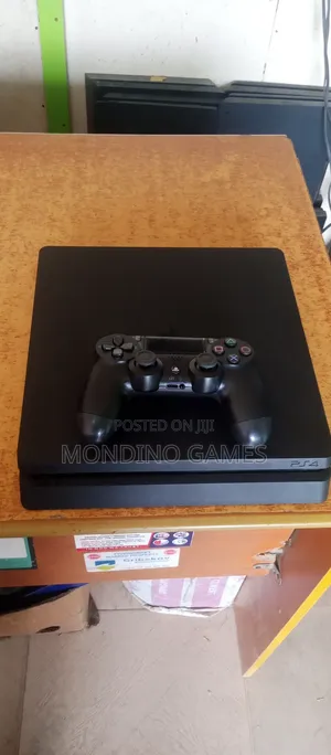 Sony Playstation 4 Slim With Two Pads and Games Inside