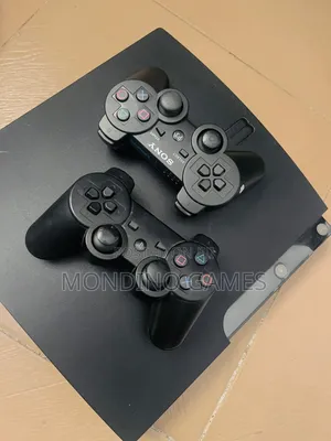 Sony Playstation 3 Slim With Two Pads and 10 Games Inside