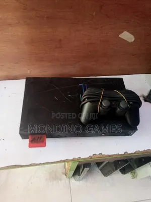 Sony Playstation 2 With Two Pads and 15 Games Inside