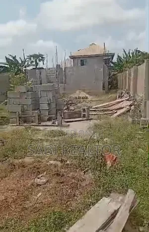 Land for Sale | Aalmost Half Plot of Land With a Structure at Ikotun