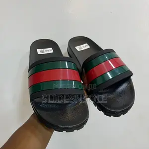 Gucci Men's Web Rubber Slide Sandal.