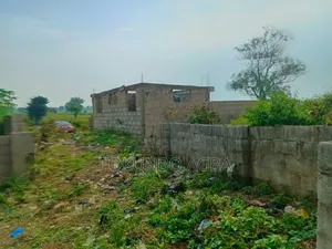 Over 1,000 SQM of Fenced Land With Borehole 5 Units of S/C Carcass