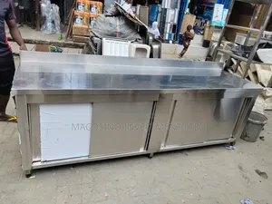 Stainless Steel Commercial Kitchen Work Table Featuring Slide Doors