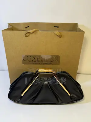 Rich Aunty Clutch Bag With a Gold Frame
