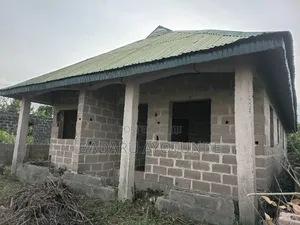 Almost a Plot With 3 Mini Flats( Roofed, Fenced, Gated)