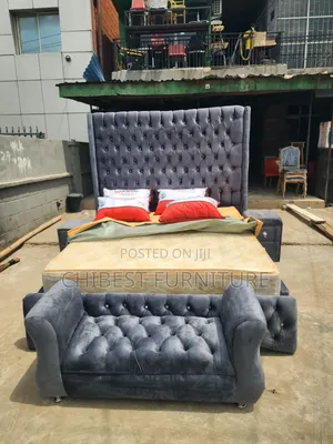 A 6by6 Upholstery Bed With Its Side Drawers and Footrest