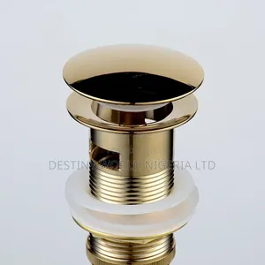 Pop Up Sink Drain Stopper in a Brushed or Polished Gold Finish.
