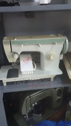 Singer Electric And Manual Machine