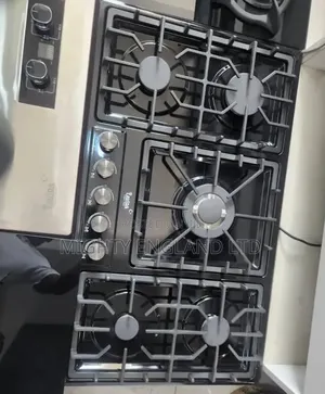 Built-in Gas Cooktop With a Black Glass Surface, Five Burners