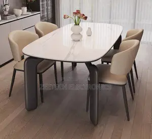 Modern Dining Set Featurin a White Faux Marble Table Beige Upholstered