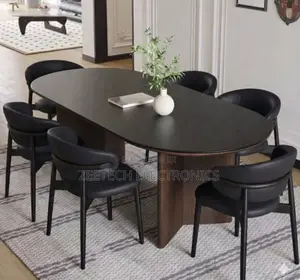 Modern Oval Dining Table Set Featurea Black Top a Dark Wood Pedestal