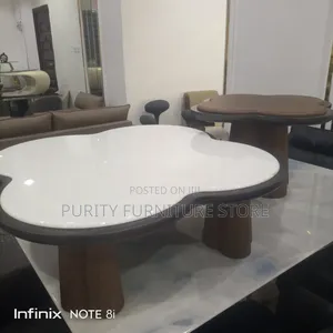 Modern White Cloud-Shaped Coffee Table With Dark Trim and Wooden Legs