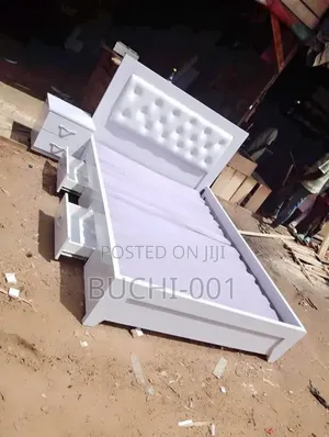 A Modern Upholstered Bed Frame or Tufted Panel Bed Bedside Drawers.