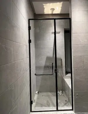Sleek Fixed Panel + Hinge Door Shower Cubicle Installed. 