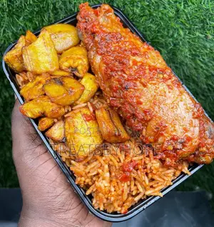 A Plate of Smoked Jollof, Plantain and Turkey.