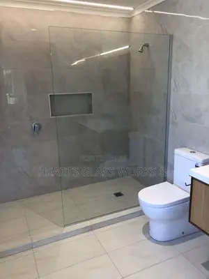 Open Up Your Bathroom Space With a Modern One-Sided Glass Enclosure.