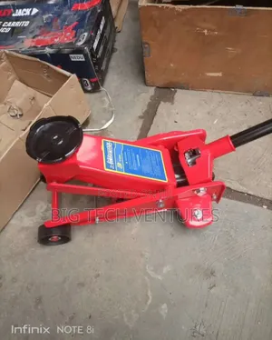 Appears to Be a 3-Ton Hydraulic Floor Jack, Commonly Used for Lifting