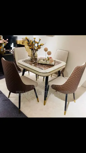 Glass Table and Quilted Leather Chairs.
