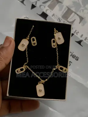 Female Dangling Stainless Steel Gold Necklace and Earrings
