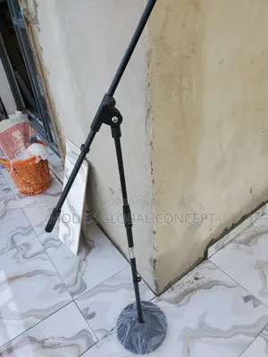 Generic Black Adjustable Microphone Floor Stand With a Round Base.