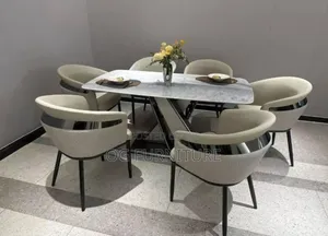 A Unique Royal Dinning Table With Beautiful Chairs.