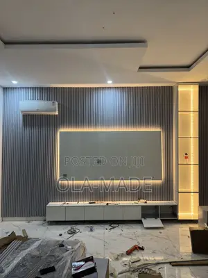 Luxury Tv Space With HDF Glossy Boards and Good Lighting