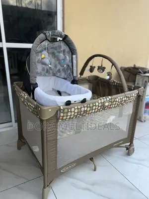 Graco Baby Cot With Extra Bassinet, Baby Rattle and Net