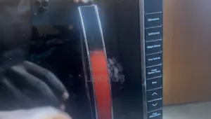 Almost New Microwave With Accessories