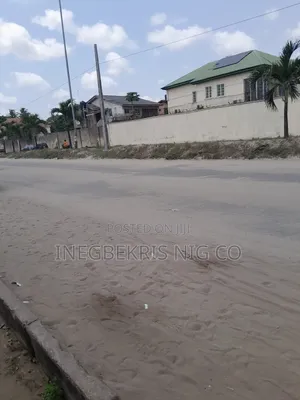 Fenced Commercial Land Along 2nd Ave Festac Town for Sale