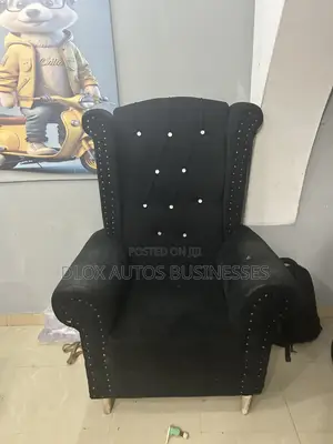 Neatly Used Wingback Chair With Original Fabric